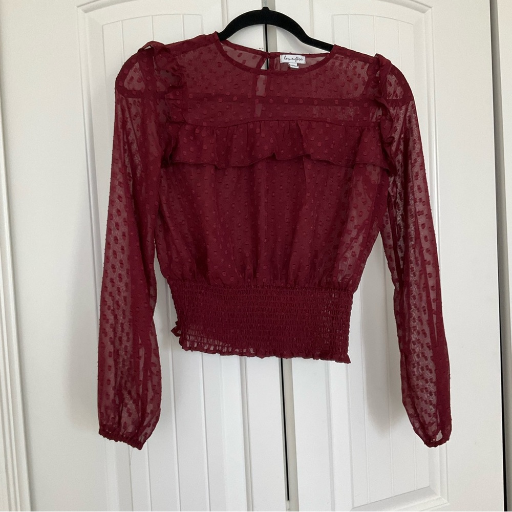 Love fire los Angela’s small ruffed blouse